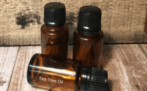 3 brown bottles of tea tree oil